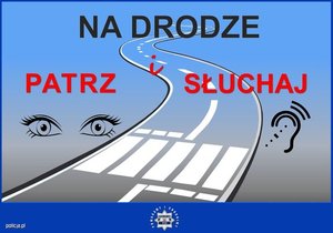 plakat z napisem na drodze patrz i słuchaj na tle drogi, oczu i uszu